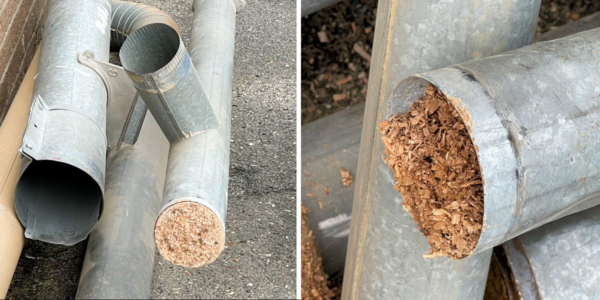 Clogged wood dust pipe in school shop before dust collection system upgrade